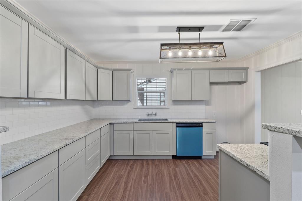 3557 Winston Road Fort Worth, TX 76109 - Photo 7 of 25 a kitchen with stainless steel appliances granite countertop a sink stove and cabinets