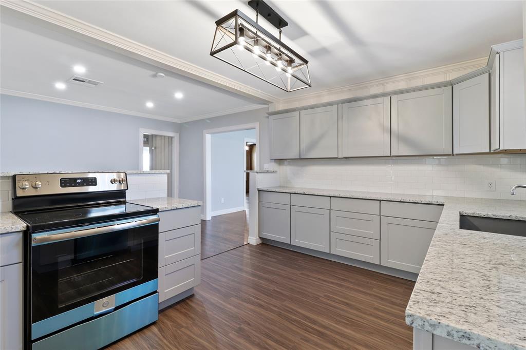 3557 Winston Road Fort Worth, TX 76109 - Photo 9 of 25 a kitchen with sink cabinets and stainless steel appliances