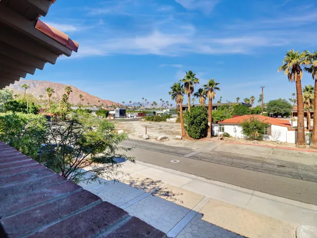 a view of a street with a building in the background