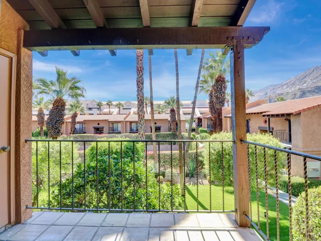 a view of a balcony with plants