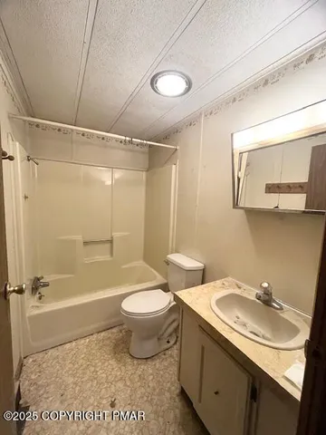 a bathroom with a sink toilet tub and shower