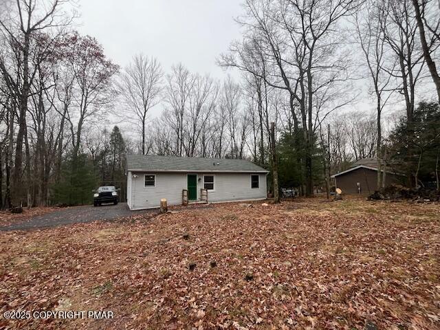 24 Indian Trail Road Jim Thorpe, PA 18229 - Photo 8 of 9 a front view of a house with a yard