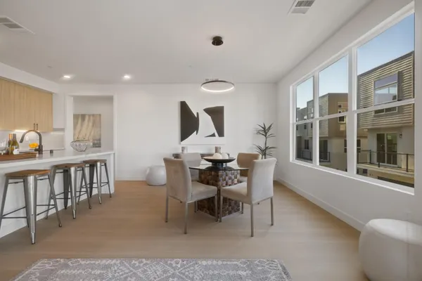 a dining room with furniture and window