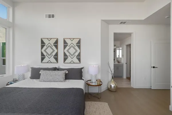 a bedroom with a bed and a couch