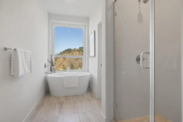 a bathroom with a tub and shower