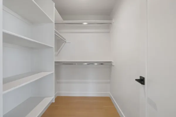 a view of room with racks on the wall