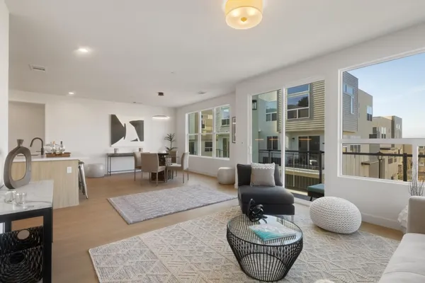 a living room with furniture and a table