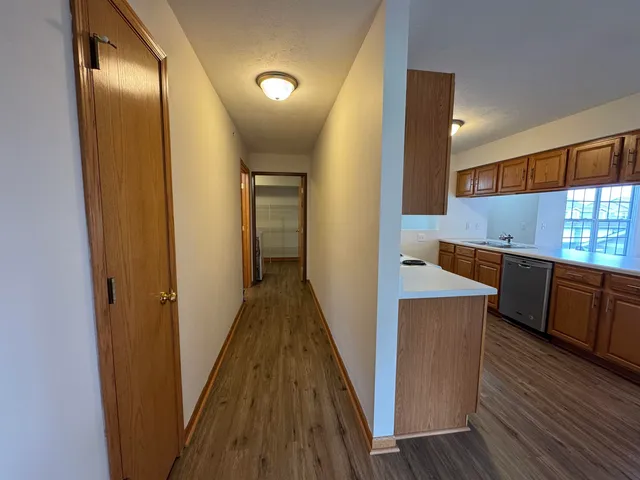 a view of a kitchen from the hallway