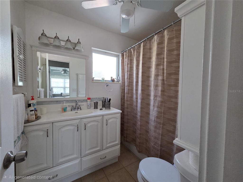 6022 Lilli Way, Unit 6022 Bradenton, FL 34207 - Photo 18 of 30 a bathroom with a toilet sink and mirror