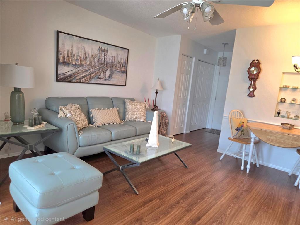 6022 Lilli Way, Unit 6022 Bradenton, FL 34207 - Photo 4 of 30 a living room with furniture and a wooden floor