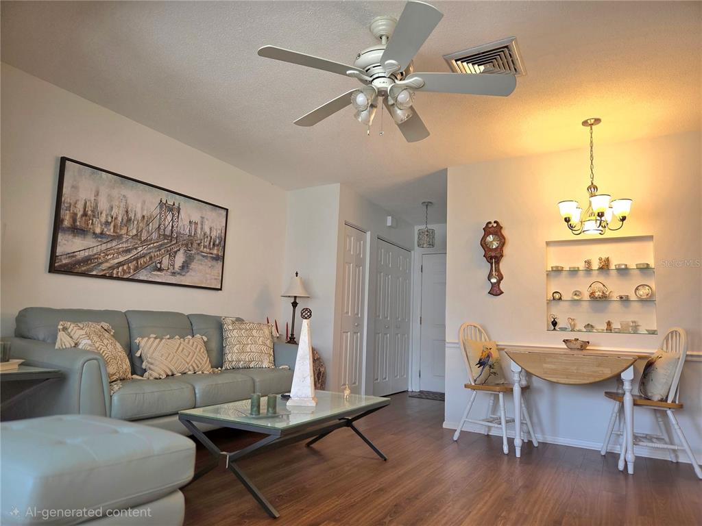 6022 Lilli Way, Unit 6022 Bradenton, FL 34207 - Photo 5 of 30 a living room with furniture and a table