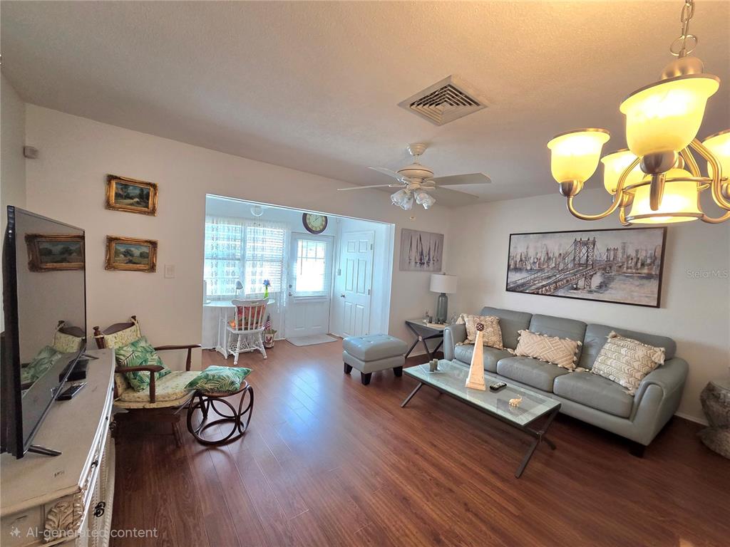 6022 Lilli Way, Unit 6022 Bradenton, FL 34207 - Photo 6 of 30 a living room with furniture and wooden floor