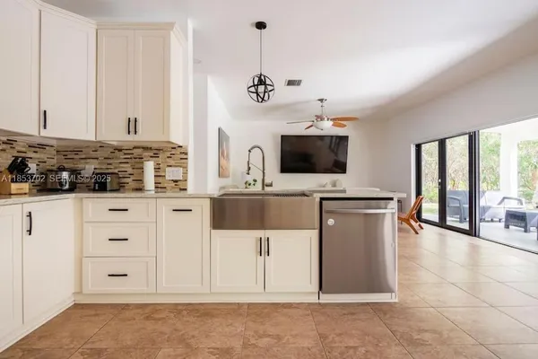 a spacious bathroom with a double vanity sink and a mirror