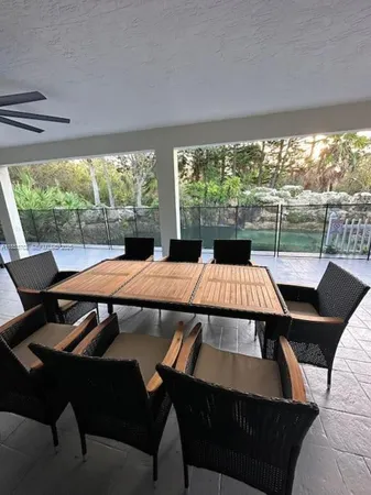 a view of a dining room with furniture and window