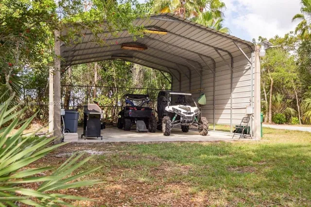 a view of a chairs and table in the patio