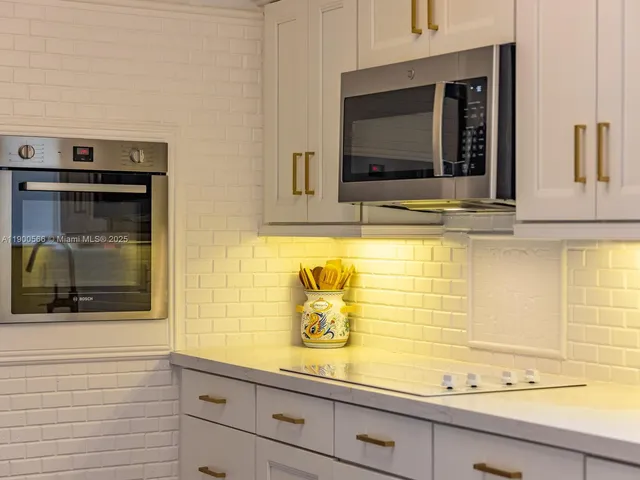a view of a livingroom with workspace and a window