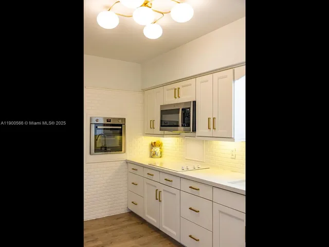 a vase of flowers sitting on a table with a window