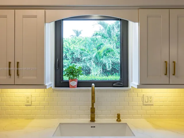 a view of a room with a window and a table