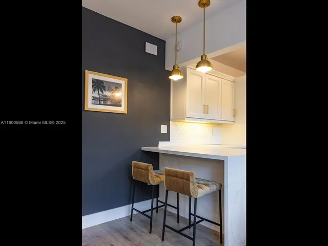 a bathroom with a toilet a sink a mirror a bathtub and vanity