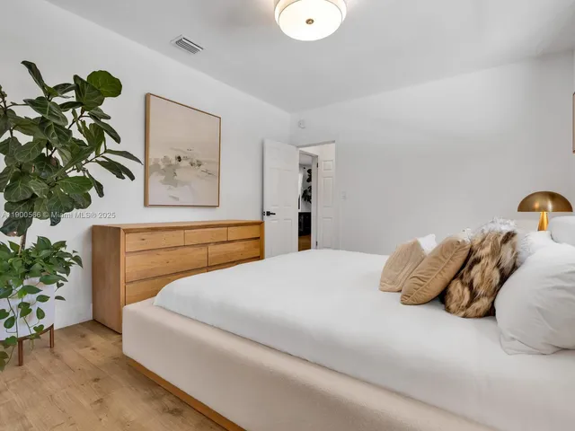 a view of a patio with a table chairs and a fire pit