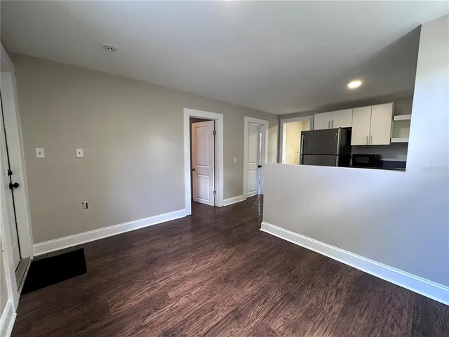 a view of a kitchen with a sink and an oven