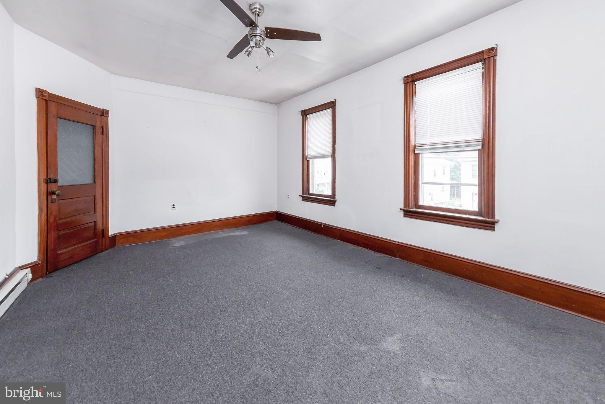 504 West Broad Street Gibbstown, NJ 08027 - Photo 11 of 37 a view of an empty room with a window