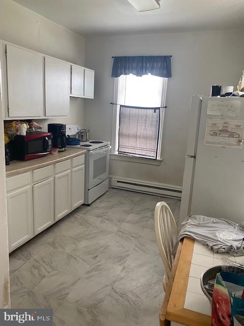 504 West Broad Street Gibbstown, NJ 08027 - Photo 18 of 37 a kitchen with a sink window and cabinets