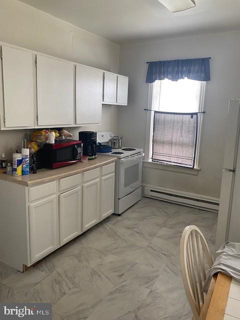 504 West Broad Street Gibbstown, NJ 08027 - Photo 19 of 37 a kitchen with stainless steel appliances granite countertop a sink a stove and white cabinets