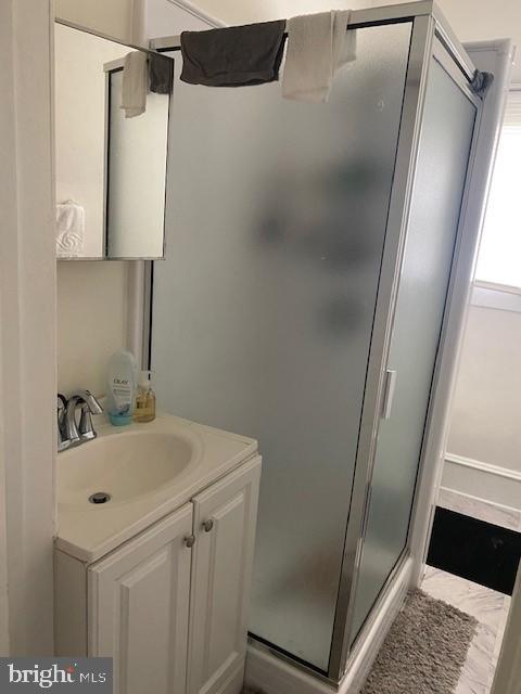 504 West Broad Street Gibbstown, NJ 08027 - Photo 24 of 37 a bathroom with a sink a mirror and shower