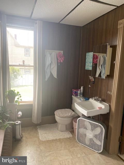 504 West Broad Street Gibbstown, NJ 08027 - Photo 32 of 37 a bathroom with a sink toilet and a mirror