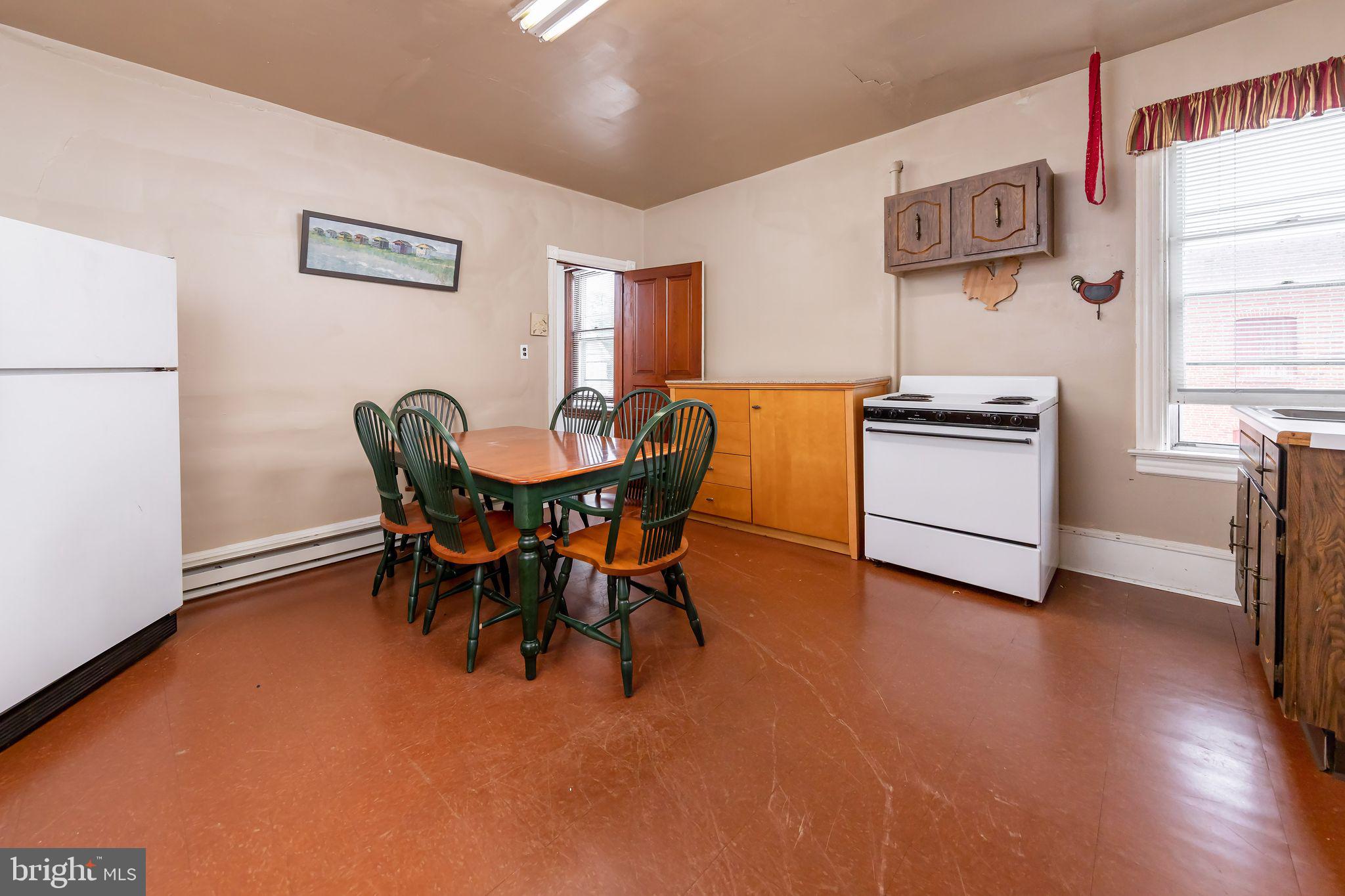 504 West Broad Street Gibbstown, NJ 08027 - Photo 10 of 37 a view of a dining room with furniture and wooden floor