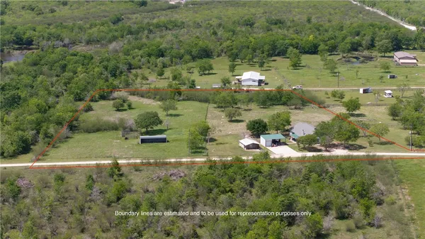 a view of a dining room with furniture and window