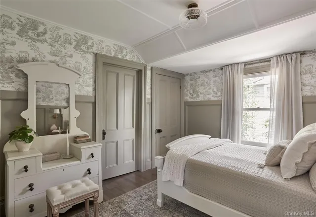 a bedroom with a bed and a couch