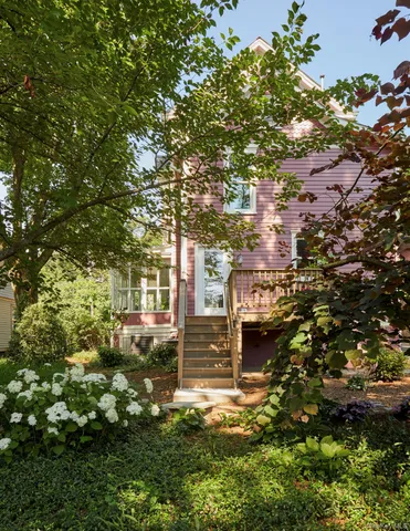a view of a house with a tree