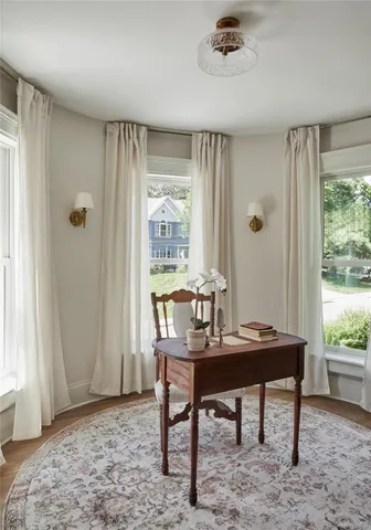 a bathroom with a toilet a sink and a window