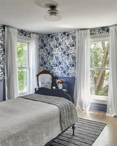 a view of a chair and table in the garden