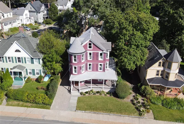 an aerial view of residential house and sandy dunes