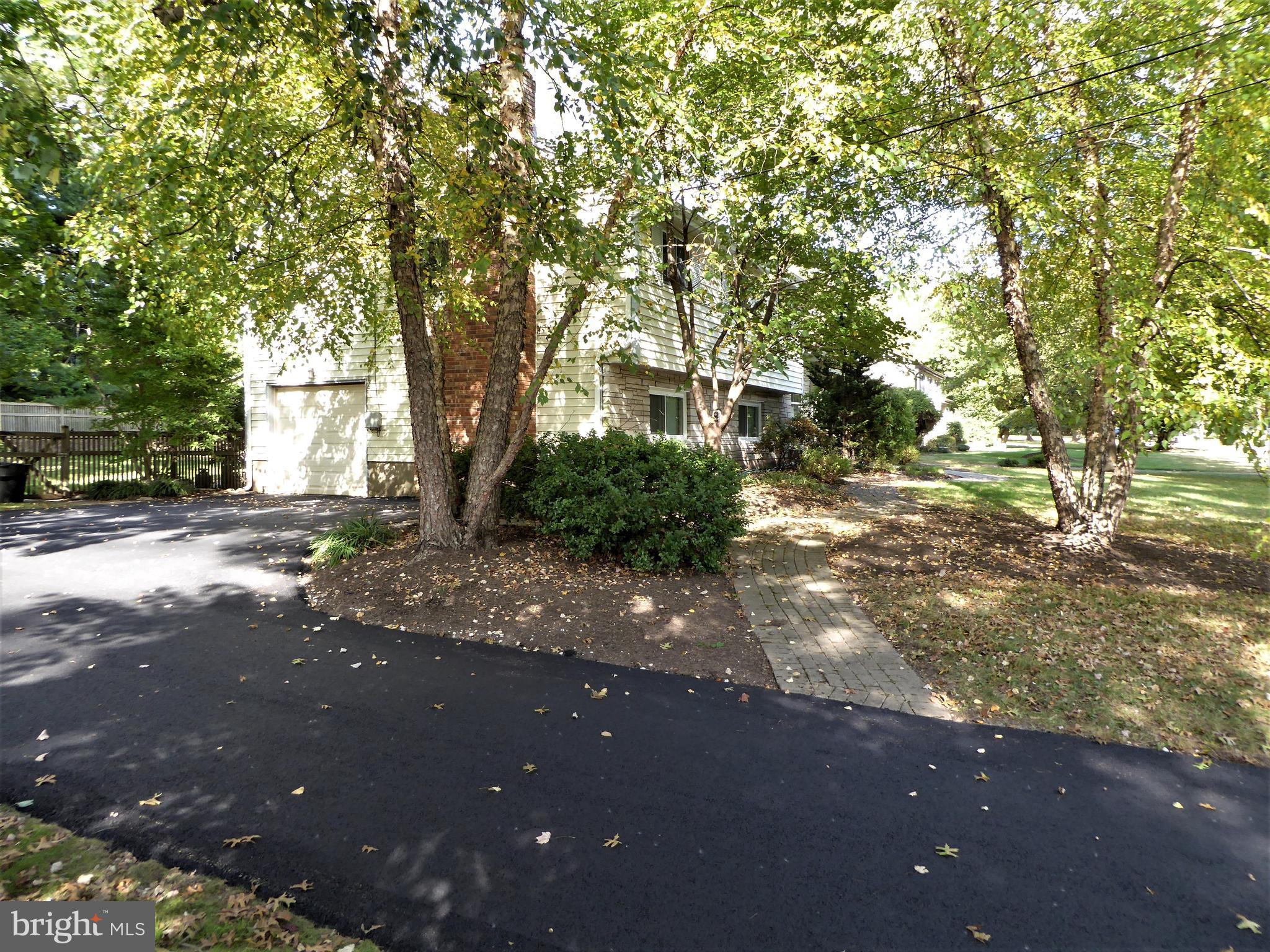 10 Bayberry Road Ewing, NJ 08618 - Photo 27 of 29 Side entrance garage and paver pathway.