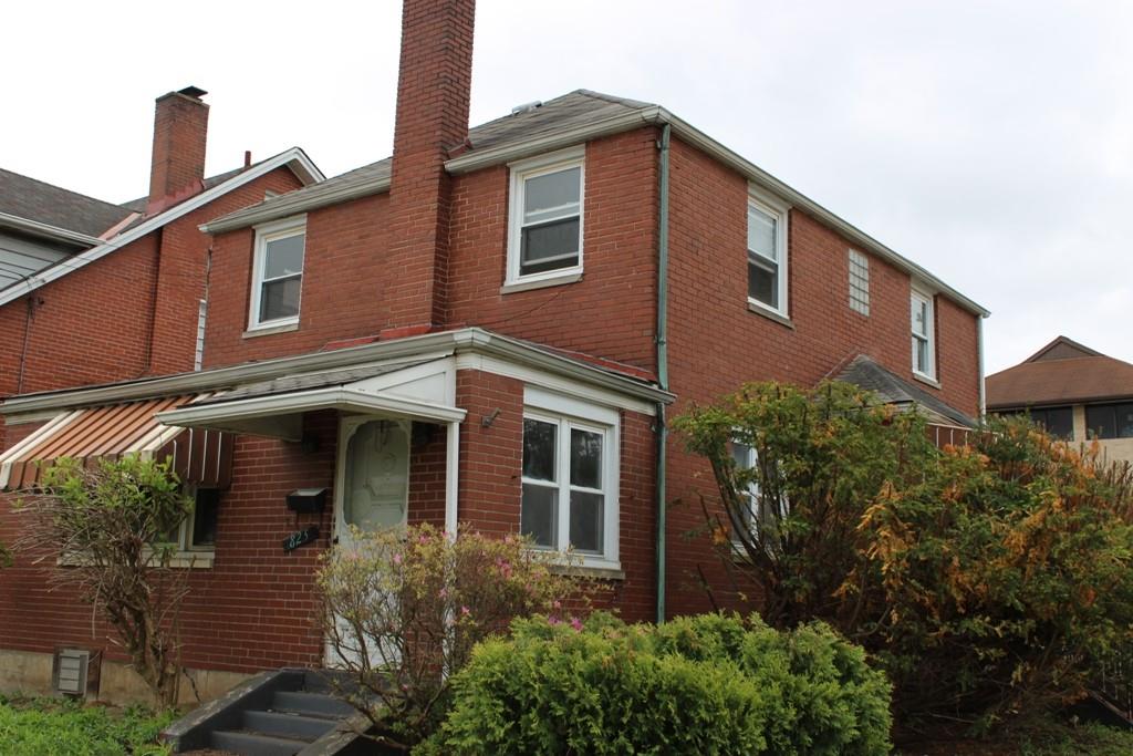 825 Liberty Street Duquesne, PA 15110 - Photo 2 of 25 a front view of a house with plants