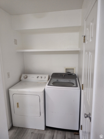 1735 West 540 North, Unit 1402 St. George, UT 84770 - Photo 7 of 14 Laundry area featuring wood finished floors and washing machine and clothes dryer