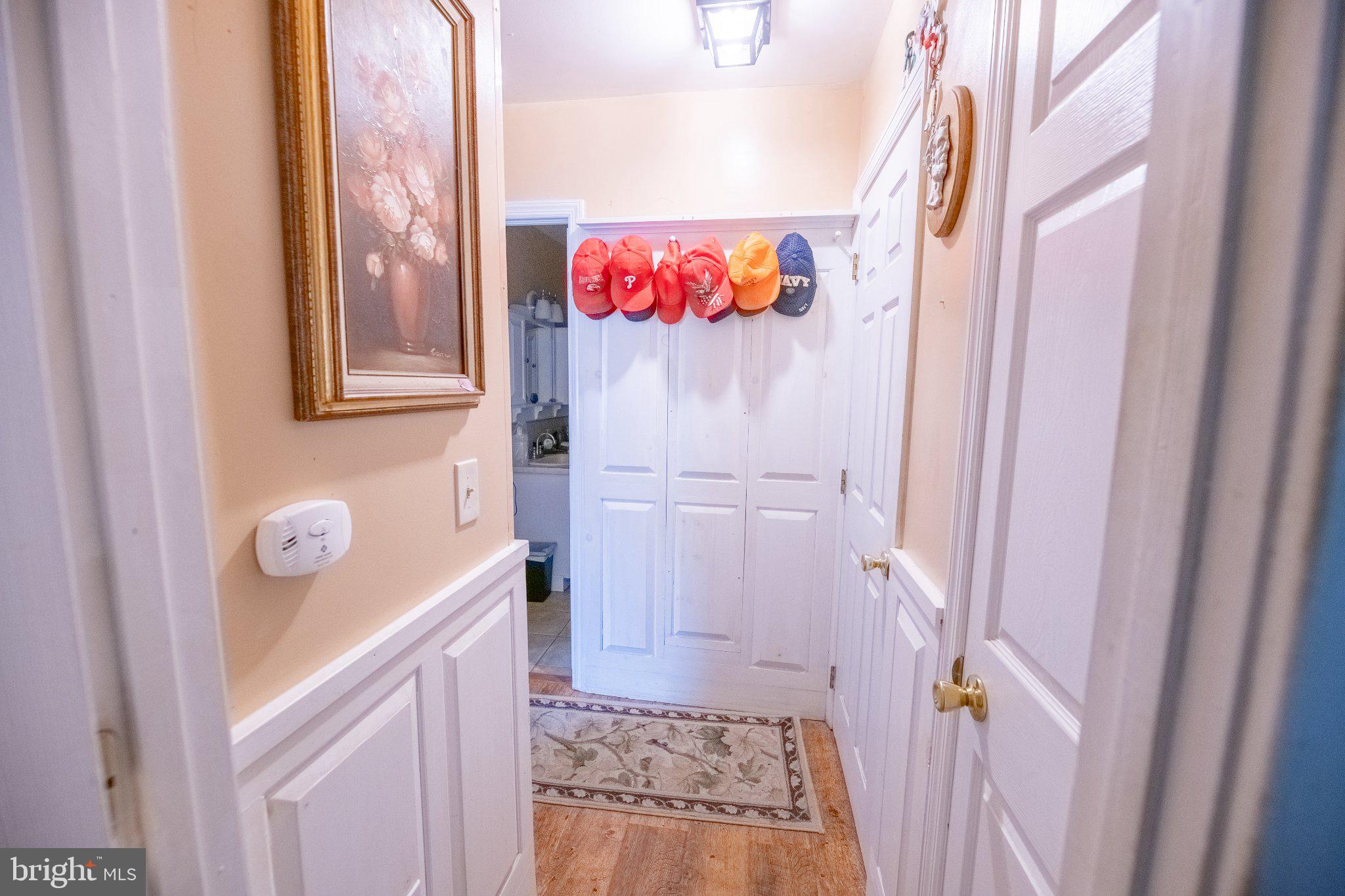 57 Diverty Road Pennington, NJ 08534 - Photo 25 of 86 Welcoming hallway with vibrant hats.