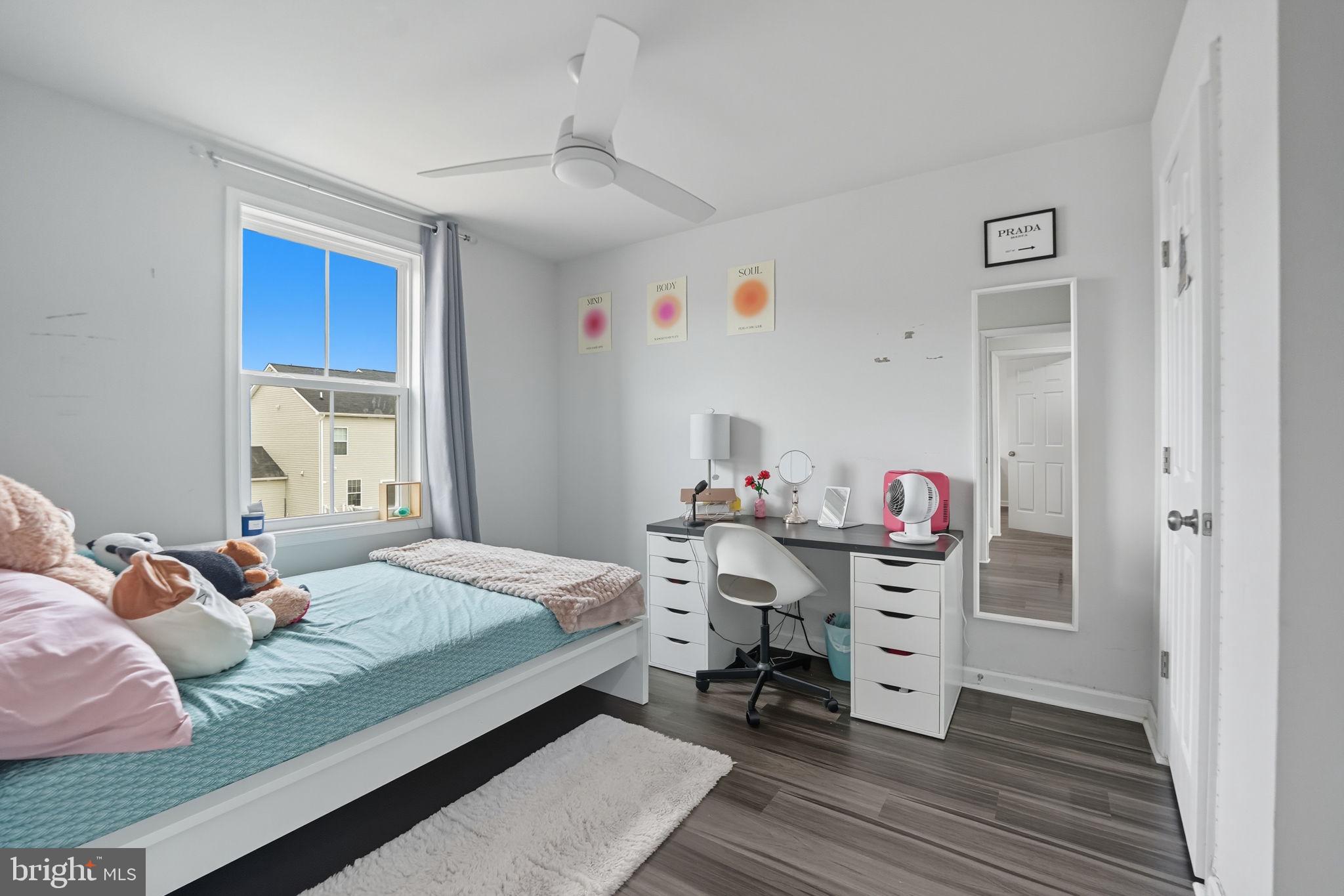 119 Interlace Way Stephenson, VA 22656 - Photo 12 of 22 a bedroom with a bed and wooden floor