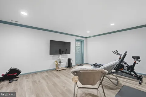 a view of a livingroom with furniture and a flat screen tv