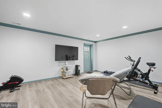 a view of a livingroom with furniture and a flat screen tv