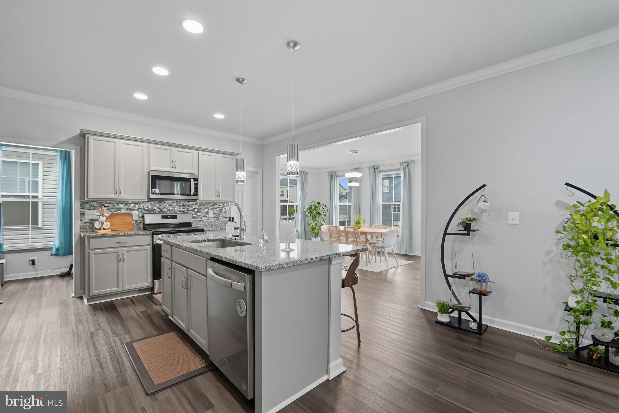 119 Interlace Way Stephenson, VA 22656 - Photo 4 of 22 a kitchen with sink cabinets and wooden floor