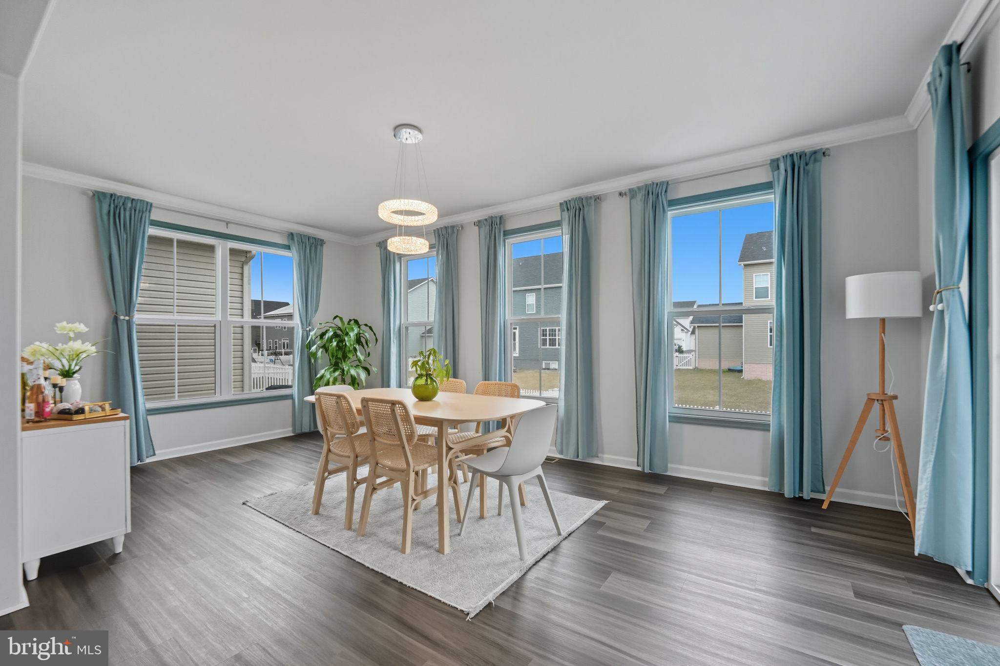 119 Interlace Way Stephenson, VA 22656 - Photo 8 of 22 a view of a dining room with furniture window and wooden floor