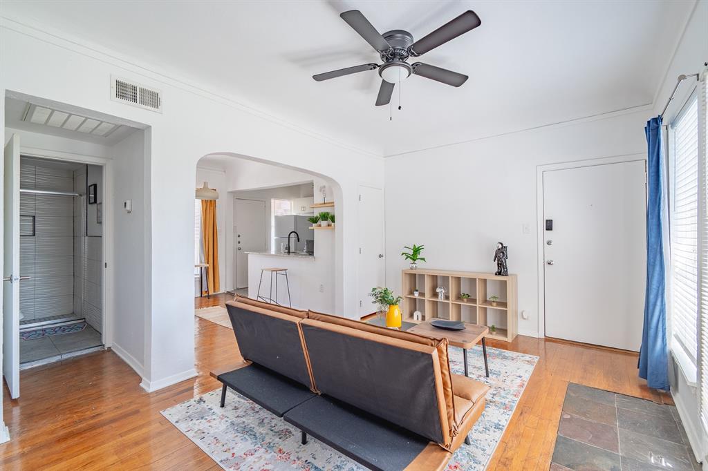 5305 Reiger Avenue, Unit 2 Dallas, TX 75214 - Photo 6 of 15 a living room with furniture and a wooden floor