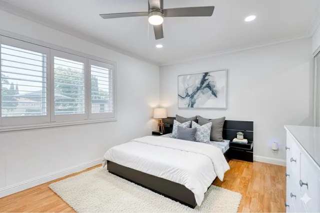 a bedroom with a large bed and a window