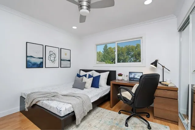 a bedroom with furniture and a window