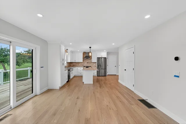 a view of kitchen with wooden floor